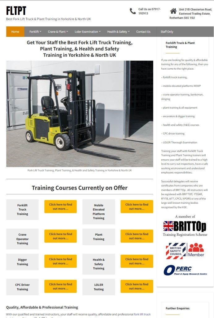 Yellow and black Clark forklift truck parked outside an industrial warehouse unit.